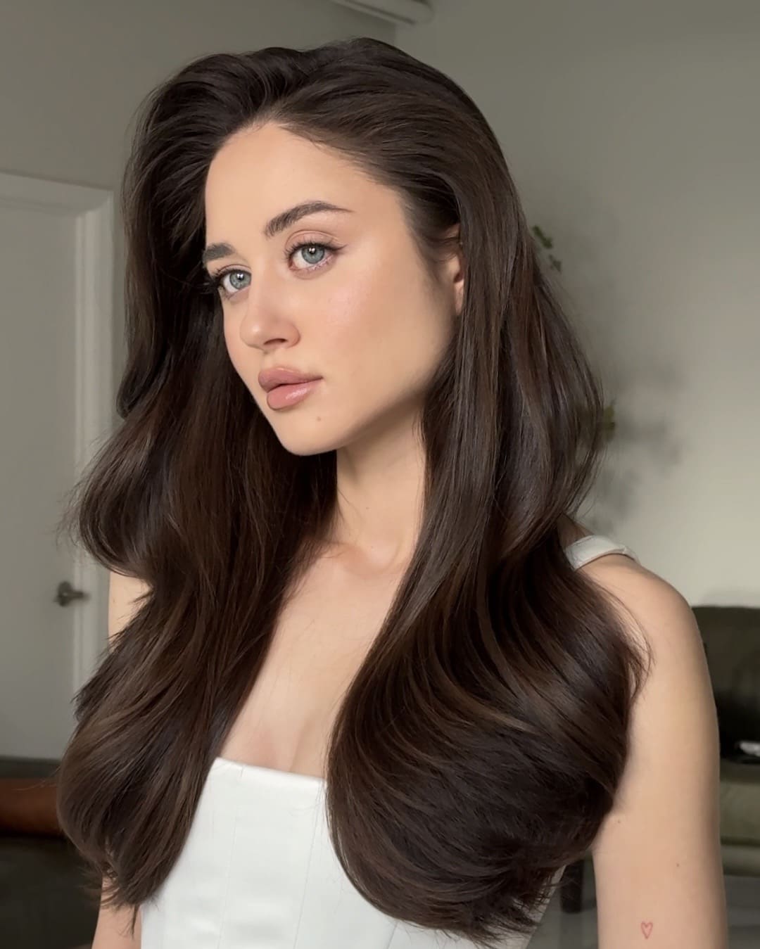 bride with a blow out hairstyle poses for a photo, a 2026 hair trend brides have been loving so far!