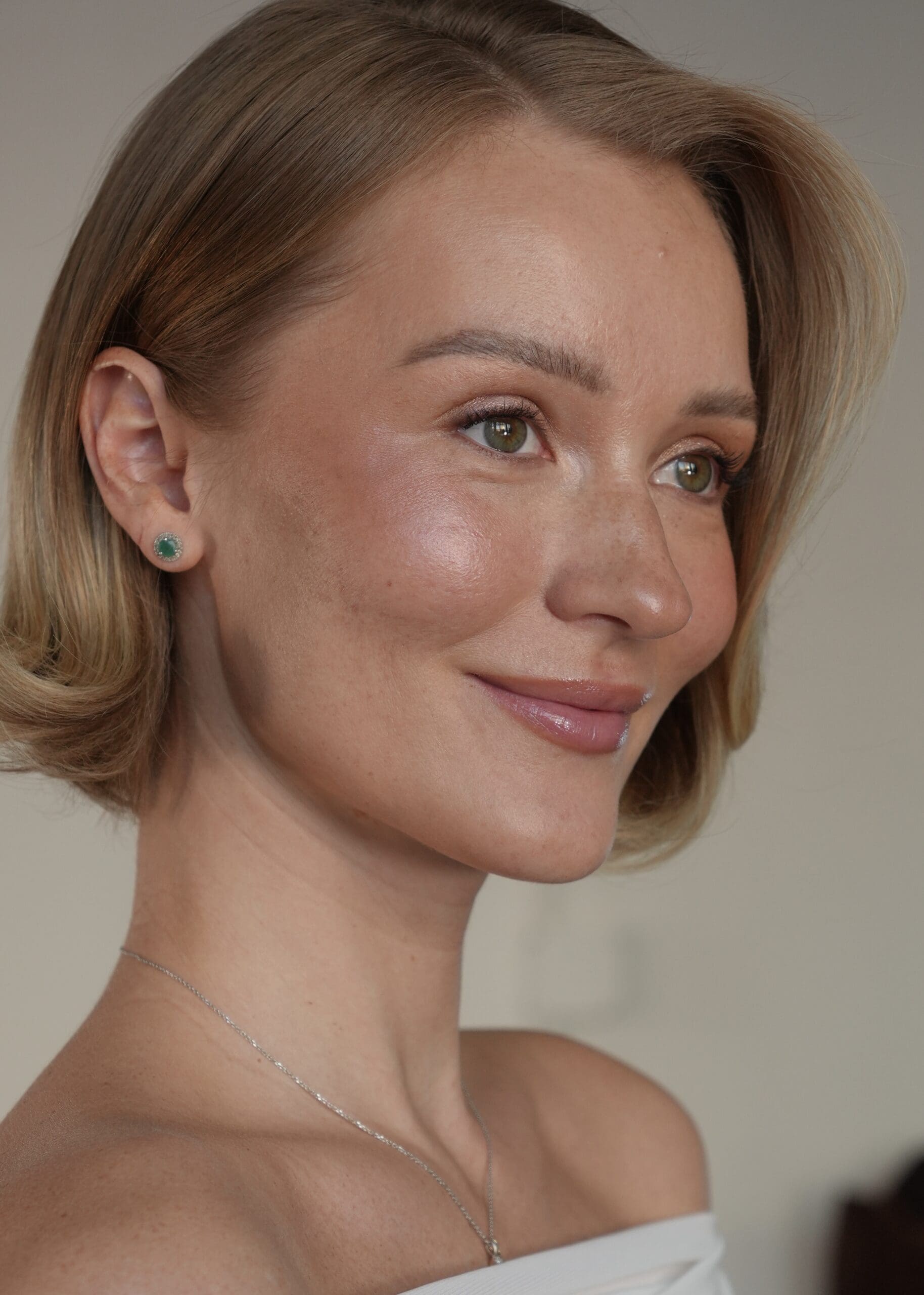 stunning bride shows off her make up look for her big day, clearly showcasing the importance of skin prep before makeup