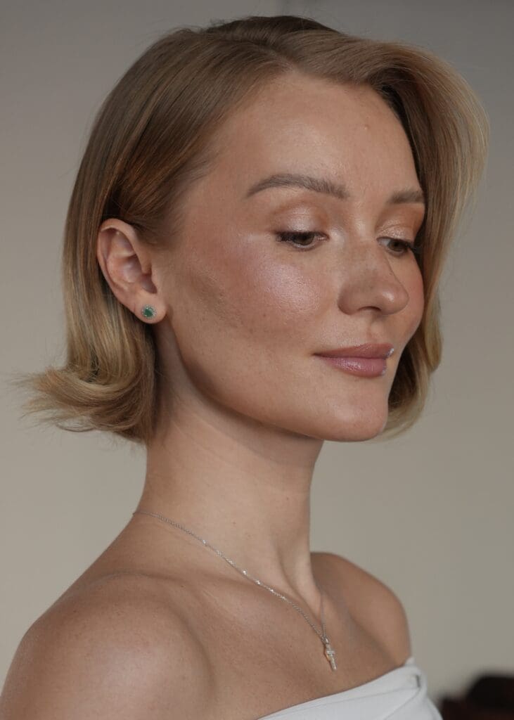 stunning bride shows off her make up look for her big day, clearly showcasing the importance of skin prep before makeup