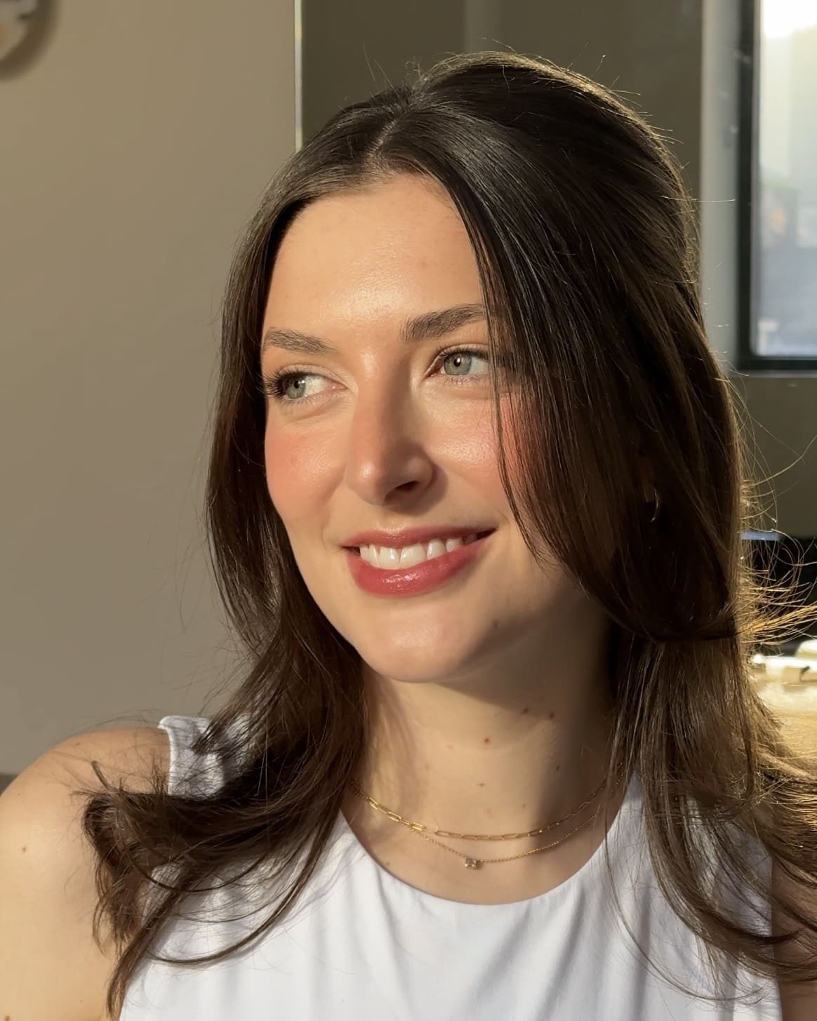 beautiful bride glows in the natural light showing the sheer importance of skin prep before makeup