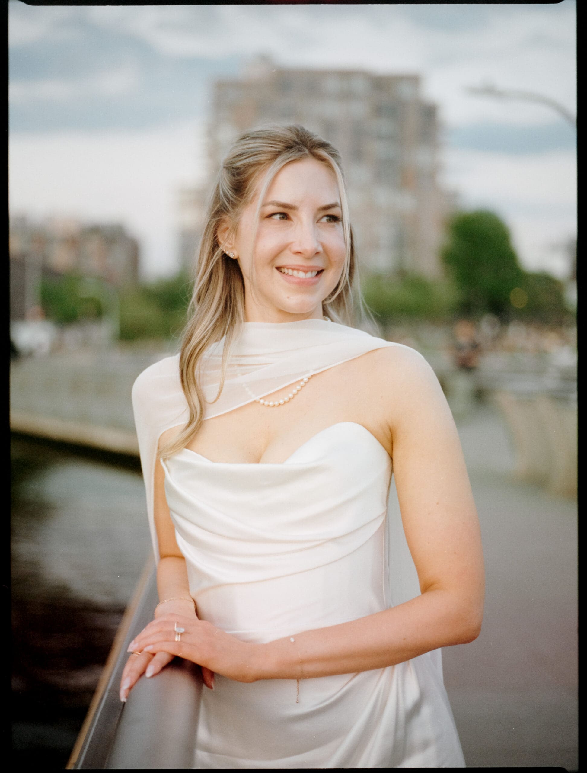 bride poses for a photo during her bridal beauty timeline on her wedding day