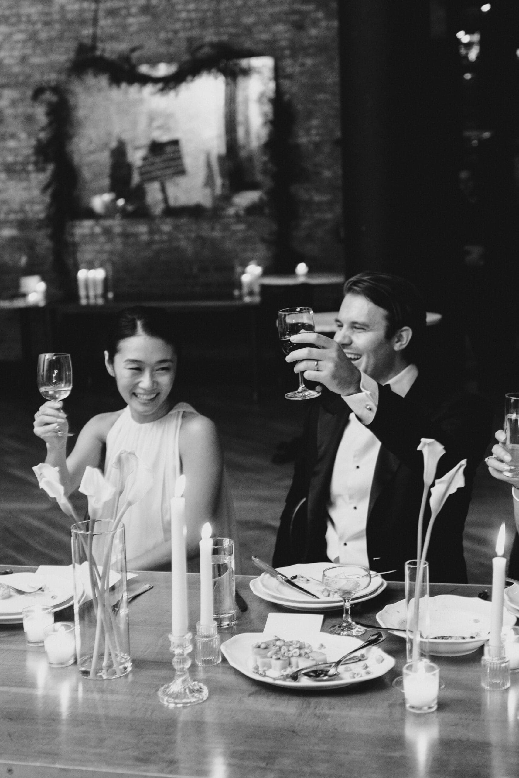 bride and groom share a toast with the guests that came to their wedding