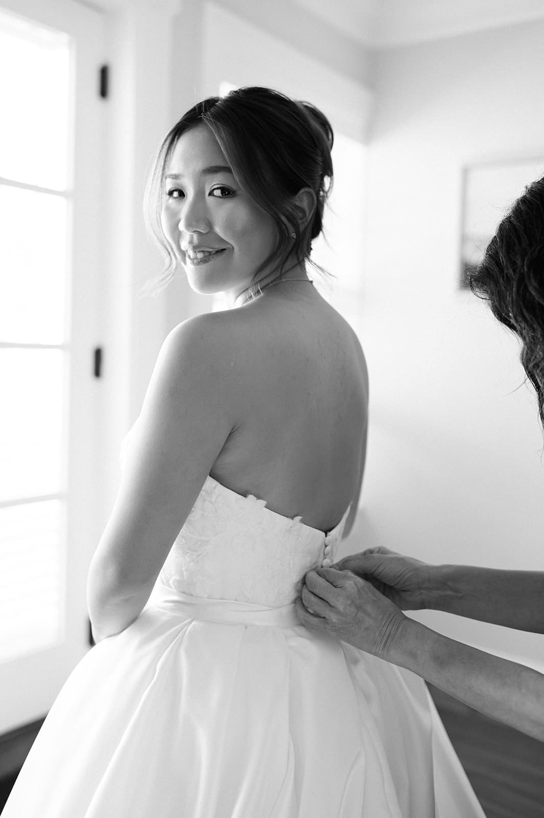 bride prepares for her stunning East Coast wedding day with hair and makeup provided by NYC wedding vendor SM Beauty